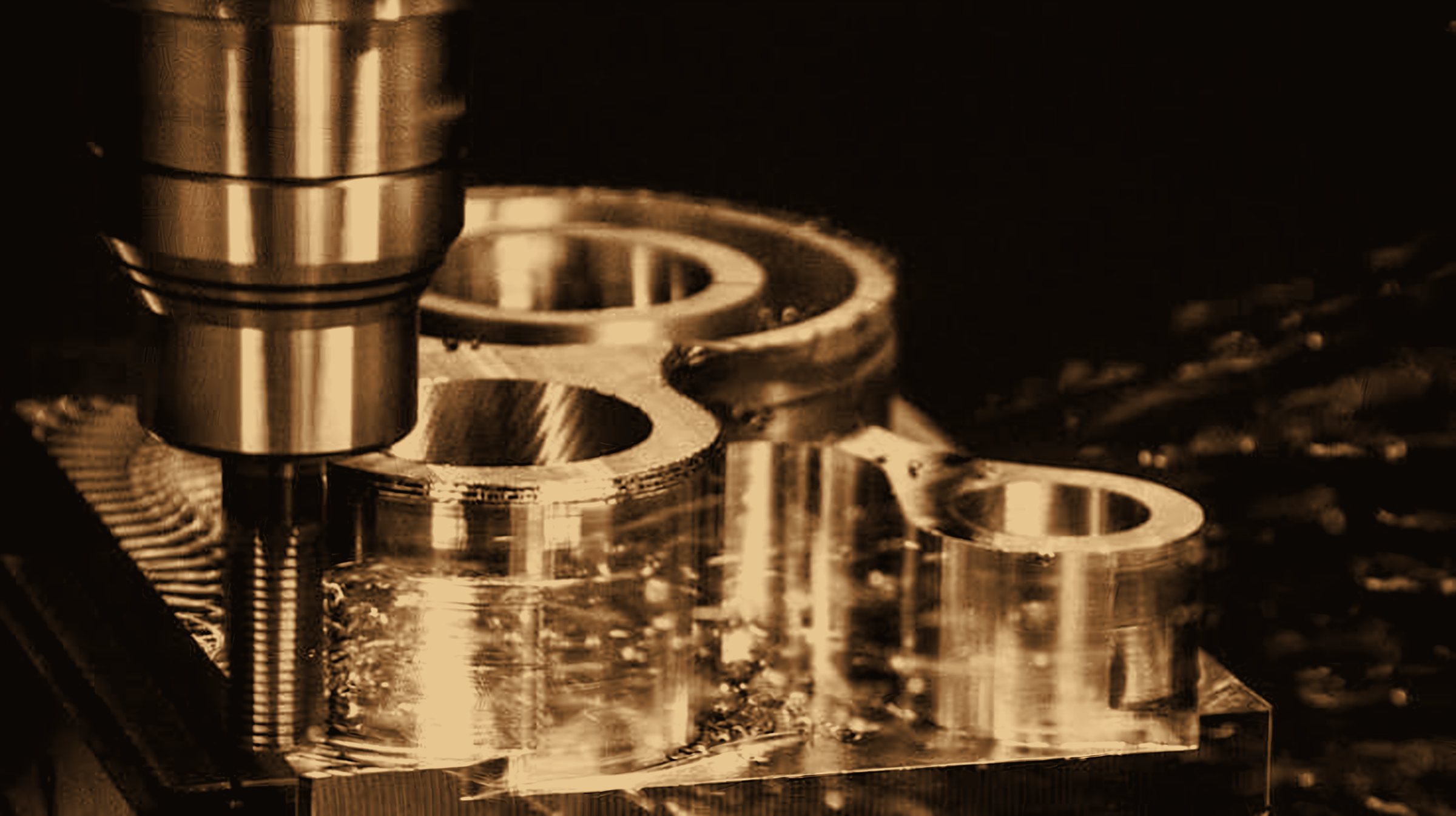 Sepia-toned photograph of a CNC machining head cutting precision metal parts
